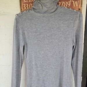 Holland Cooper turtleneck with silver buttons on  the shoulder